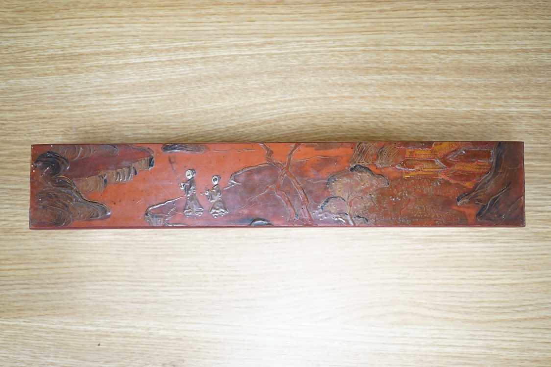 A Chinese red lacquered stand, 39cm wide